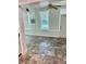 Spacious living room with large window, ceiling fan and vinyl flooring at 4020 55Th N St # 1106, Kenneth City, FL 33709