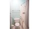 Bathroom featuring a toilet, sink and shower with handrails at 413 Lake Point Ct # 4B, Sun City Center, FL 33573