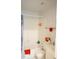 Bright bathroom features a tub with shower and white tiled walls at 413 Lake Point Ct # 4B, Sun City Center, FL 33573