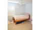 Bedroom with wooden bed and shuttered windows at 413 Lake Point Ct # 4B, Sun City Center, FL 33573