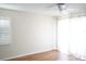 Bright bedroom with ceiling fan, wood floor and large window providing lots of natural light at 413 Lake Point Ct # 4B, Sun City Center, FL 33573