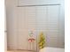 Bedroom closet with white louvered doors offers great storage space at 413 Lake Point Ct # 4B, Sun City Center, FL 33573