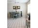 Cozy dining room features stylish decor, a window seat, and neutral tile floors at 413 Lake Point Ct # 4B, Sun City Center, FL 33573