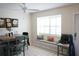 Bright dining area with a window seat, comfortable seating, and a ceiling fan at 413 Lake Point Ct # 4B, Sun City Center, FL 33573