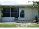 Outdoor patio space with chairs and an exterior door at 413 Lake Point Ct # 4B, Sun City Center, FL 33573