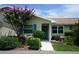 Charming home exterior featuring a well-maintained lawn, vibrant landscaping, and inviting front entrance at 413 Lake Point Ct # 4B, Sun City Center, FL 33573