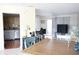 Open-concept living area featuring a dining area, modern furnishings, and bright natural light at 413 Lake Point Ct # 4B, Sun City Center, FL 33573