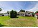 Spacious backyard with lush grass and mature landscaping at 4300 31St N Ave, St Petersburg, FL 33713
