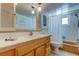 Bright bathroom with vanity sink, mirror, and shower-tub combo at 4300 31St N Ave, St Petersburg, FL 33713