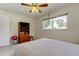 Bright bedroom featuring neutral walls, tile flooring, a window, and a ceiling fan at 4300 31St N Ave, St Petersburg, FL 33713