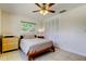 Cozy bedroom with tile flooring, ceiling fan, and closet at 4300 31St N Ave, St Petersburg, FL 33713