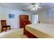 Bedroom featuring neutral walls and carpet flooring, with wood furniture and a ceiling fan at 4300 31St N Ave, St Petersburg, FL 33713