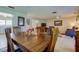 Formal dining area with wooden table, views of the living room, and neutral-toned decor at 4300 31St N Ave, St Petersburg, FL 33713