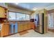 Functional kitchen featuring modern stainless steel appliances, wood cabinets, and ample counter space at 4300 31St N Ave, St Petersburg, FL 33713