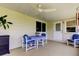 Covered patio with ceiling fan and outdoor dining set at 4300 31St N Ave, St Petersburg, FL 33713