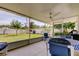 Enclosed patio features a ceiling fan and a lovely view of the landscaped backyard at 4300 31St N Ave, St Petersburg, FL 33713