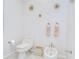 Bathroom featuring a toilet and bidet with neutral wall color and minimal wall decor at 4304 Place Le Manes, Lutz, FL 33558