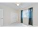 Neutral-toned bedroom with soft carpeting and double closets and a window at 4304 Place Le Manes, Lutz, FL 33558