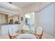 Dining area with view of kitchen and lanai at 4304 Place Le Manes, Lutz, FL 33558