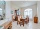 Formal dining room boasts abundant natural light, tile flooring, and classic furniture at 4304 Place Le Manes, Lutz, FL 33558