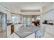 Bright eat-in kitchen features an island with cooktop, stainless appliances, and granite countertops at 4304 Place Le Manes, Lutz, FL 33558