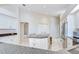 Spacious kitchen boasts granite countertops, stainless appliances, cooktop island, and tile floors at 4304 Place Le Manes, Lutz, FL 33558