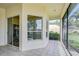The outdoor lanai has tile floors, and provides serene views of the surrounding landscape at 4304 Place Le Manes, Lutz, FL 33558