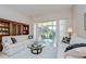 Bright living room featuring comfortable seating and large sliding glass doors to the outdoor patio at 4304 Place Le Manes, Lutz, FL 33558