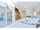 Main bedroom with glass doors opening to the patio, offering a seamless indoor-outdoor living experience at 4304 Place Le Manes, Lutz, FL 33558