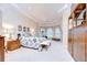 Spacious main bedroom featuring tray ceiling, ample natural light, and a comfortable seating area at 4304 Place Le Manes, Lutz, FL 33558