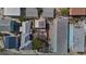 An aerial view shows the layout of several homes adjacent to one another with varying roof types at 44 77Th Ave, Treasure Island, FL 33706