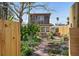 Charming two-story home with lush landscaping, privacy fence and brick walkway at 44 77Th Ave, Treasure Island, FL 33706
