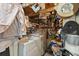 A functional basement area with a washer, tools, and storage showcasing utility and organization at 44 77Th Ave, Treasure Island, FL 33706