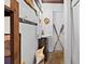 Nautical bathroom with a pedestal sink and vintage oars adding to the coastal aesthetic at 44 77Th Ave, Treasure Island, FL 33706