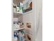 Organized closet shelves with toiletries and decor at 44 77Th Ave, Treasure Island, FL 33706