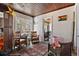 Inviting sitting area featuring a decorative rug, stained-glass window, and open doorway to another room at 44 77Th Ave, Treasure Island, FL 33706