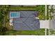 Overhead image of a beautiful home featuring a private screened-in pool and patio area perfect for outdoor living at 4505 Anaconda Dr, New Port Richey, FL 34655