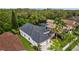 An aerial view showcasing the home's well-maintained landscaping, a spacious driveway, and a two-car garage at 4505 Anaconda Dr, New Port Richey, FL 34655