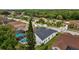 A peaceful aerial view of a home and pool surrounded by lush green landscaping, offering ultimate privacy at 4505 Anaconda Dr, New Port Richey, FL 34655