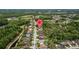 Aerial shot of homes situated among the trees in a green and Gathering-friendly residential neighborhood at 4505 Anaconda Dr, New Port Richey, FL 34655