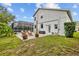 A backyard with a patterned paved patio, including outdoor furniture and a view of the screened pool enclosure at 4505 Anaconda Dr, New Port Richey, FL 34655