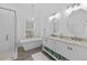Modern bathroom features a soaking tub, a glass-enclosed shower, and double vanity sinks at 4505 Anaconda Dr, New Port Richey, FL 34655