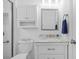 Clean bathroom with a white vanity, sleek mirror, and tiled shower at 4505 Anaconda Dr, New Port Richey, FL 34655
