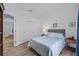 Comfortable bedroom with wood-look flooring, closet, and neutral décor at 4505 Anaconda Dr, New Port Richey, FL 34655