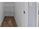 Small storage closet with shelves and wood-look flooring at 4505 Anaconda Dr, New Port Richey, FL 34655