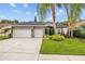 Beautiful single-story home with well-maintained landscaping, large driveway, and a three-car garage at 4505 Anaconda Dr, New Port Richey, FL 34655