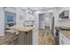 Modern kitchen with granite countertops, stainless steel appliances, and an adjacent living area at 4505 Anaconda Dr, New Port Richey, FL 34655