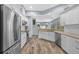 Contemporary kitchen featuring white cabinetry, stainless steel appliances, and a spacious layout at 4505 Anaconda Dr, New Port Richey, FL 34655