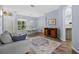 Open-concept living area with neutral paint, modern furnishings, and wood flooring throughout the space at 4505 Anaconda Dr, New Port Richey, FL 34655