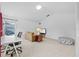 Upstairs living area with a comfortable seating and a well-lit workspace at 4505 Anaconda Dr, New Port Richey, FL 34655